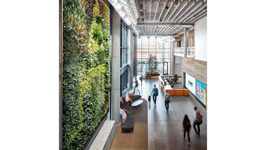 A group of people walking in a building.