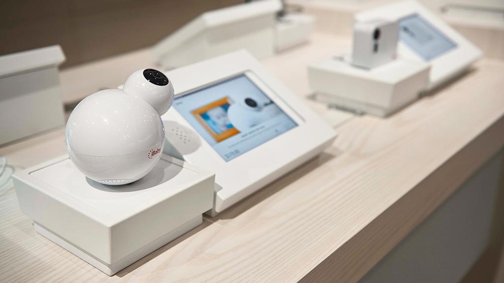 A white cube with a white ball on top of it.