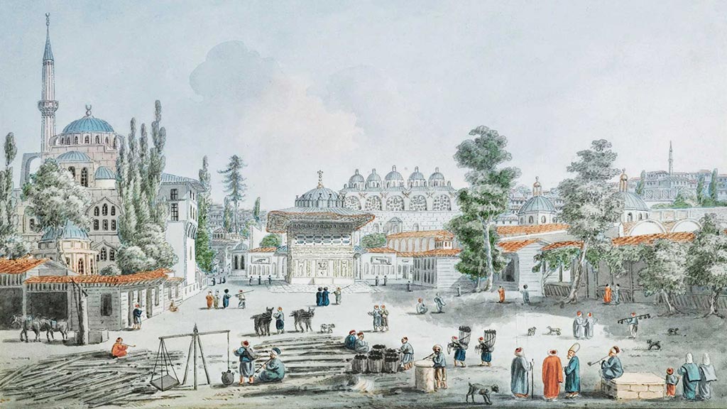 A group of people in a plaza.