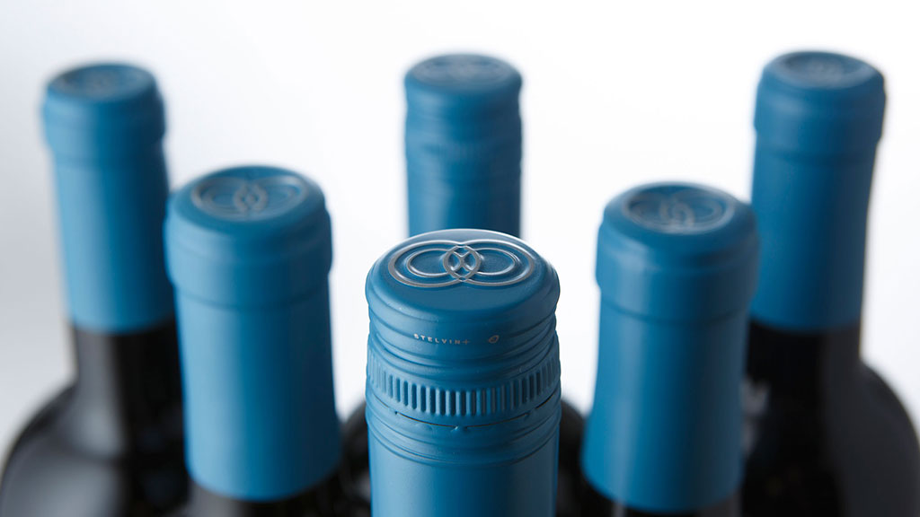A close-up of several blue bottles.