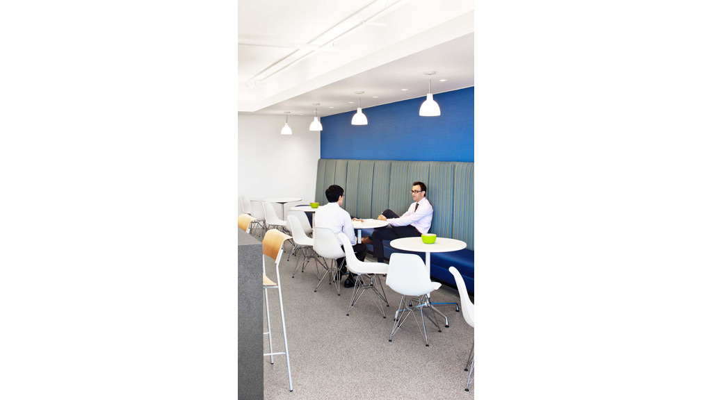 A group of people sitting at tables.