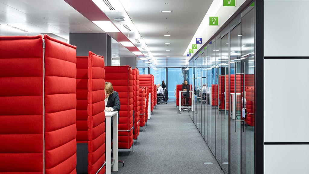 A long hallway with red and white seats.