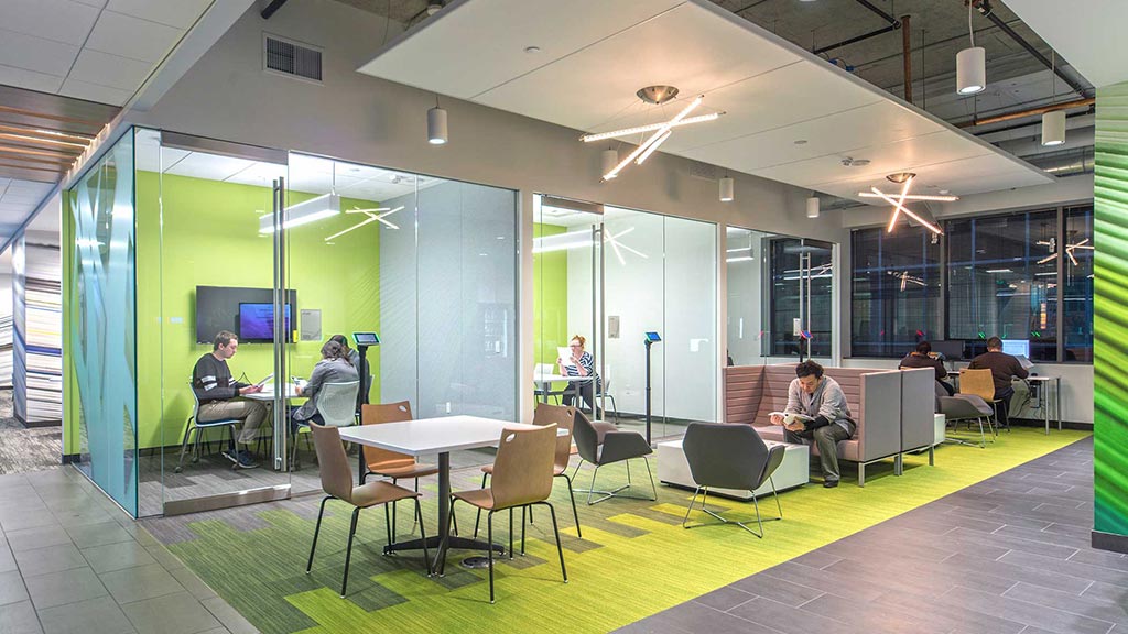 A group of people sitting at tables.