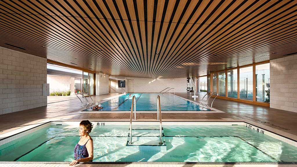 A person sitting in a swimming pool.