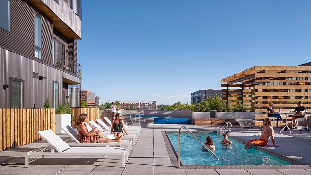 People sitting around a pool.