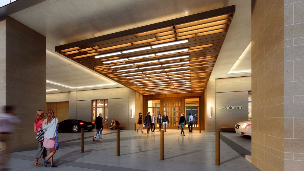 A group of people walking through a building.