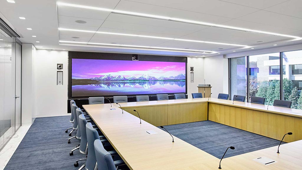 A conference room with a large screen.