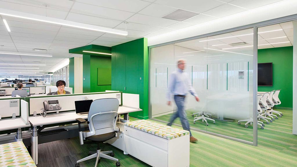 A person walking in an office.