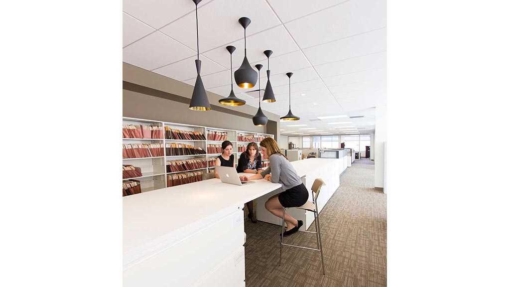 A group of people working in a library.