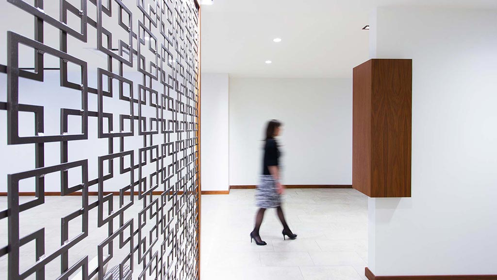 A person walking down a hallway.