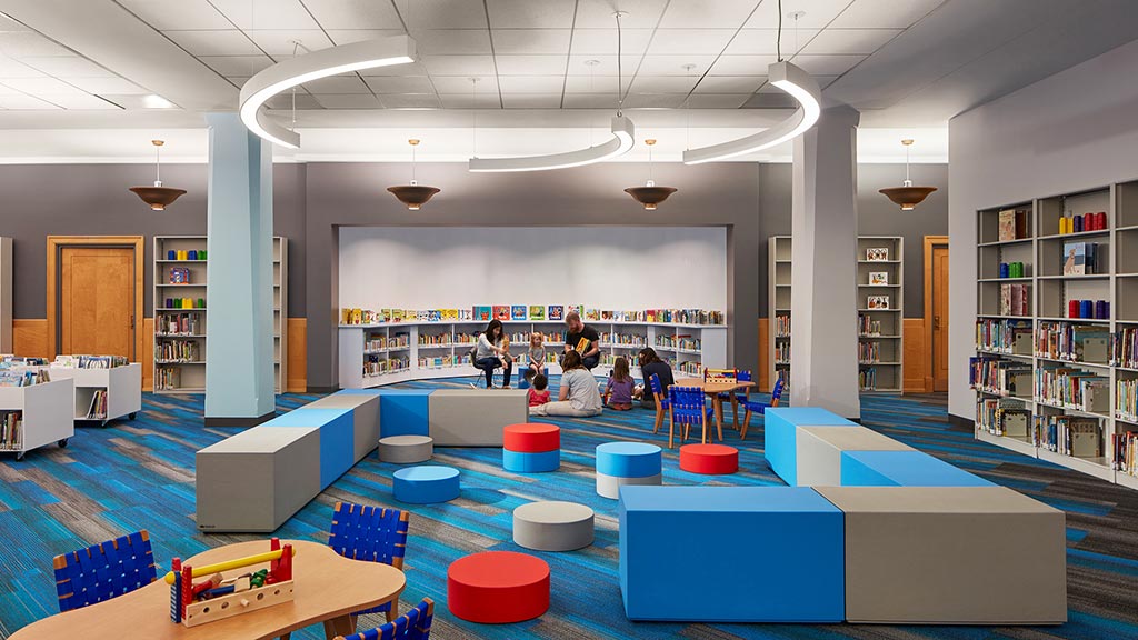 A group of people in a library.