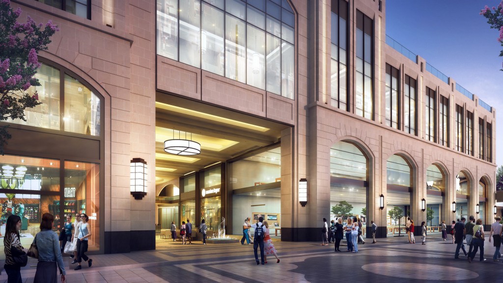 A group of people walking outside of a building.