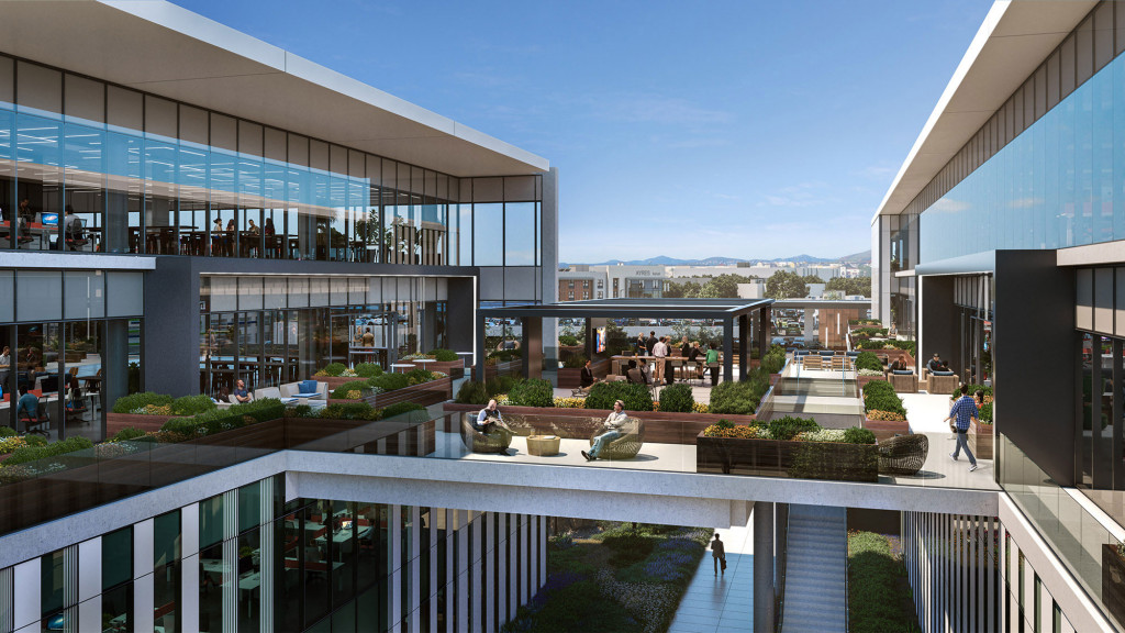A building with a pool and a courtyard with people walking around.