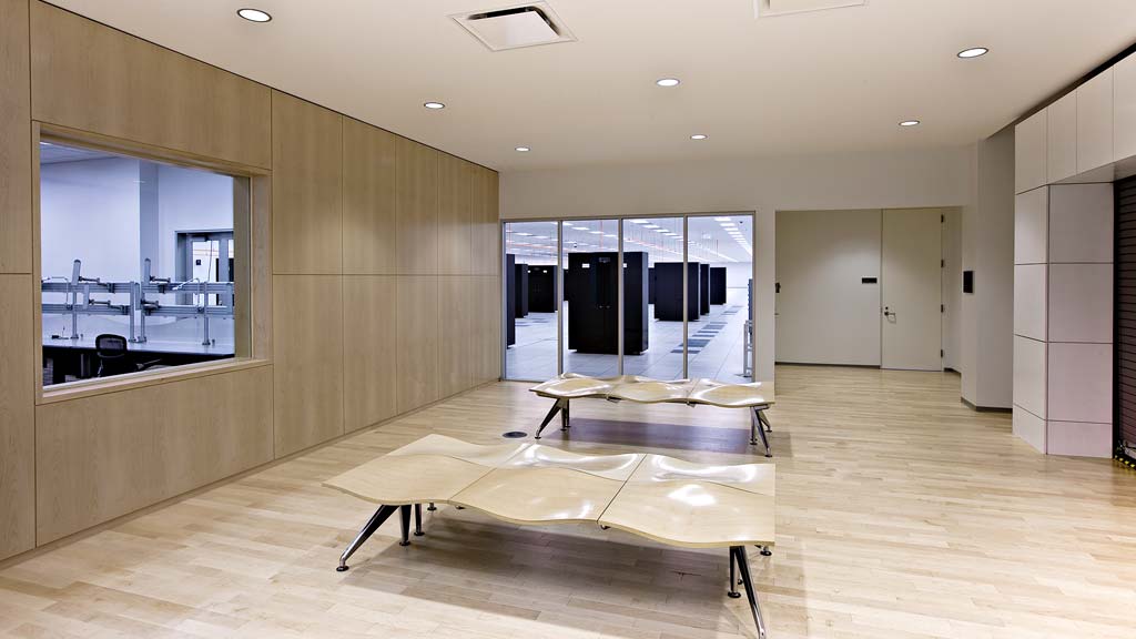 A room with a table and benches.