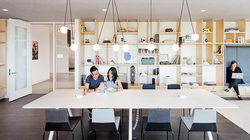 A group of people sitting at a table.