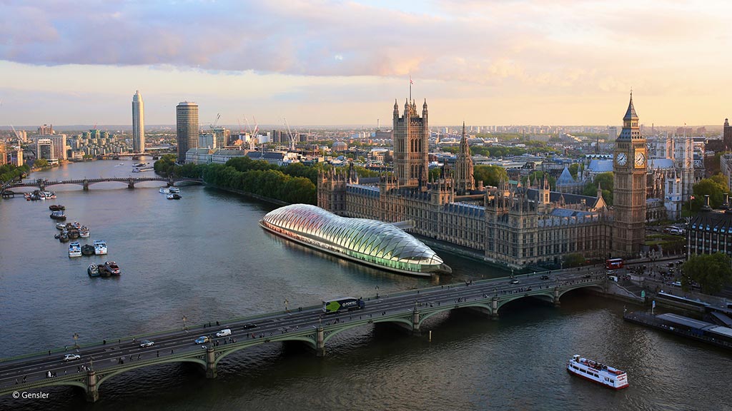 A bridge over a river with a city in the background.