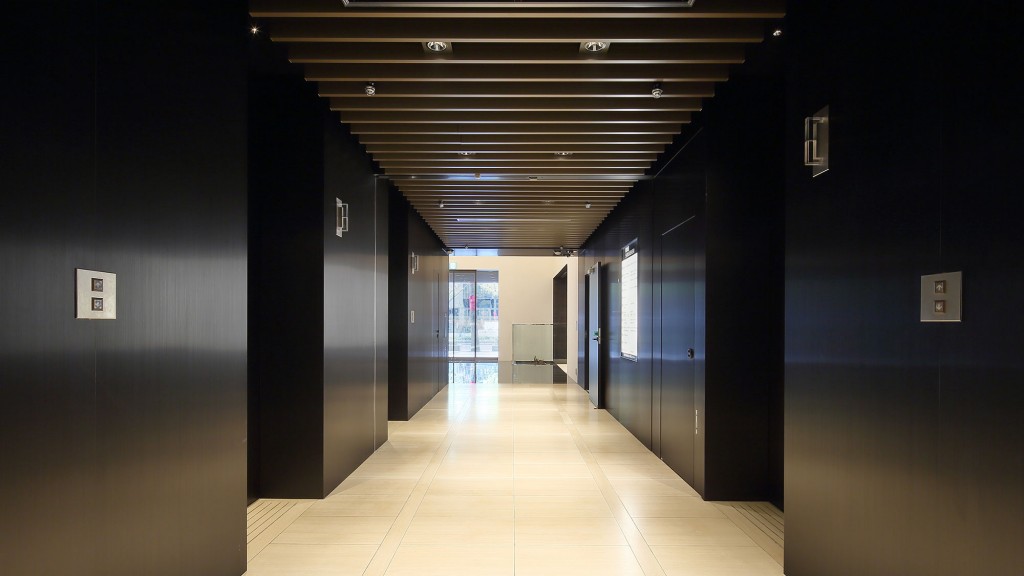 A hallway with black walls.