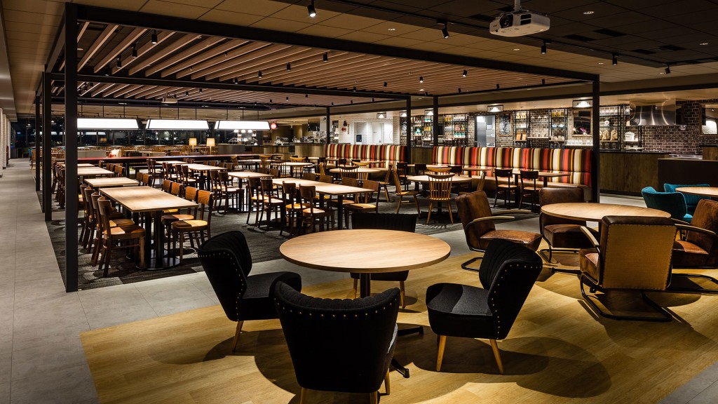 A room with tables and chairs.