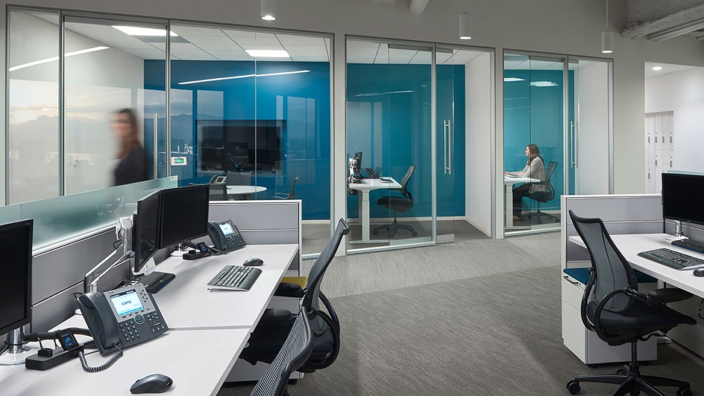 A room with a table and chairs.