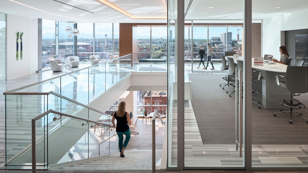 A person walking in an office.