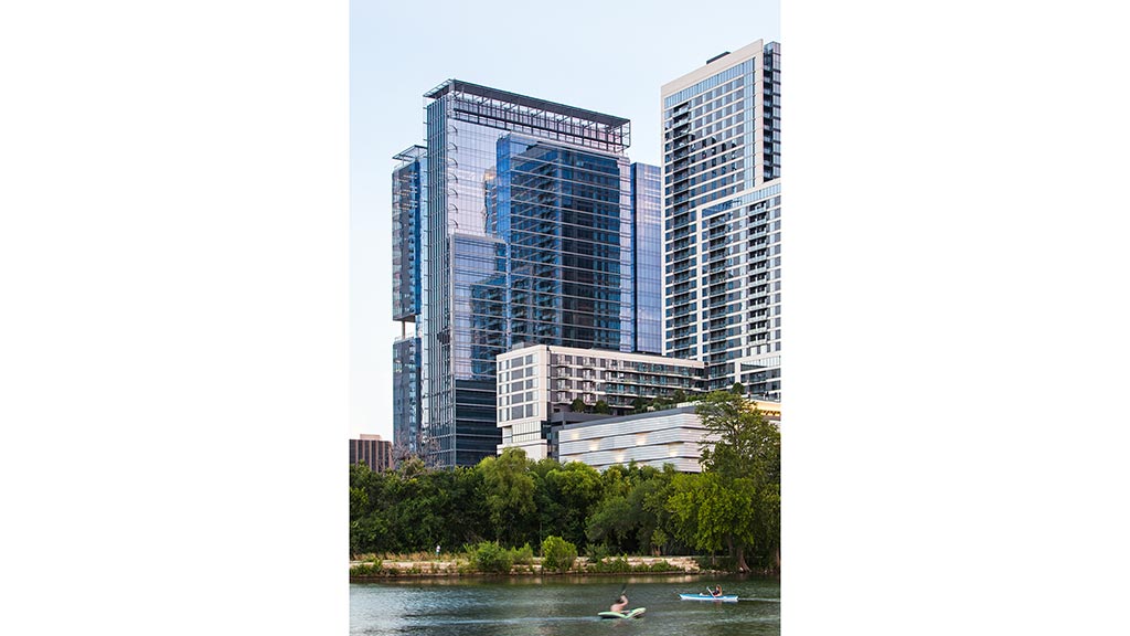 A group of buildings next to a body of water.