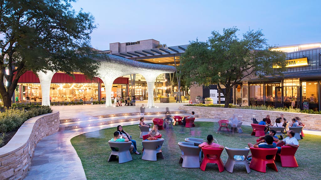 A group of people sitting outside.