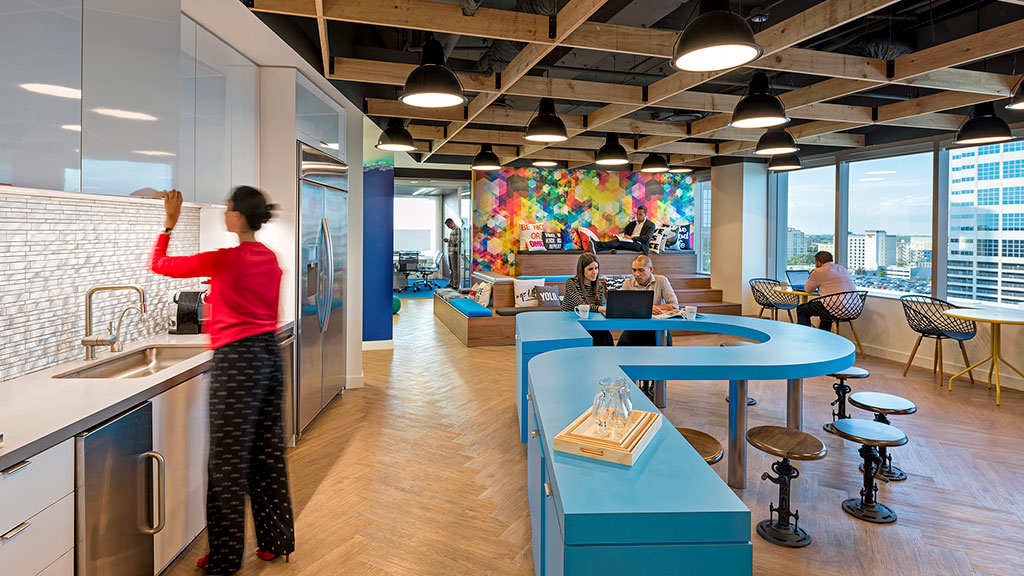 A person standing in a kitchen.