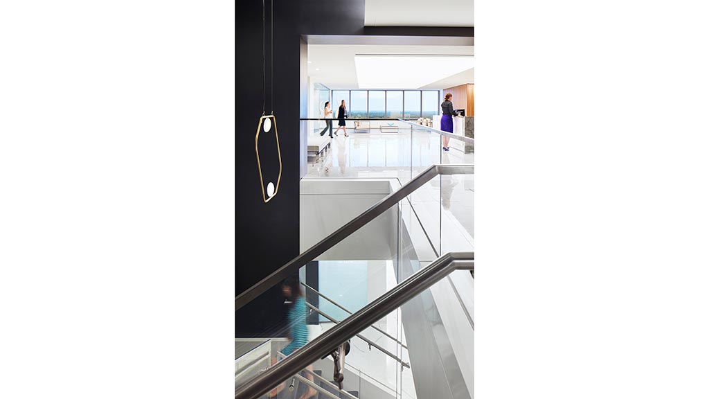 A group of people walking in a building.
