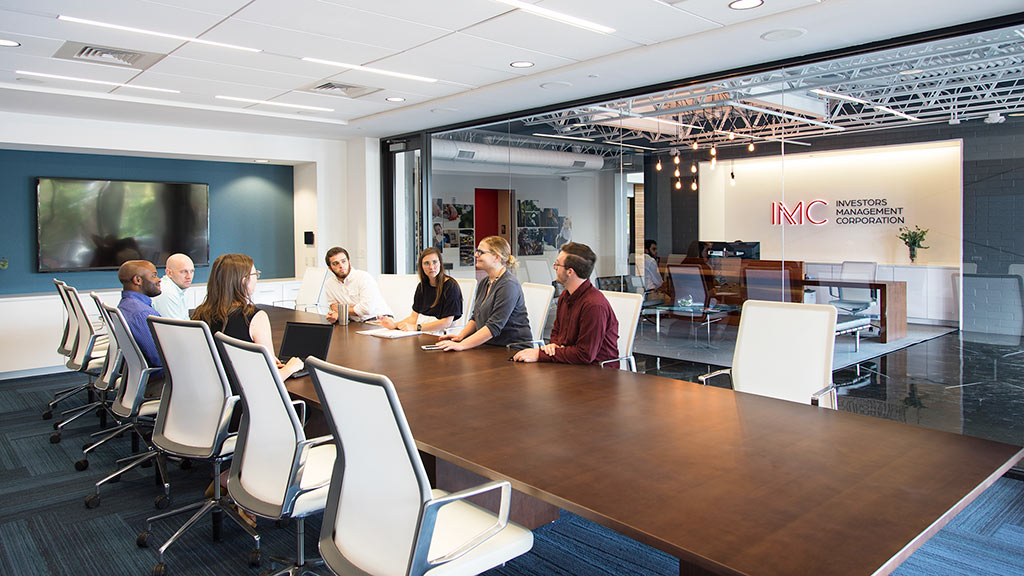 A group of people sitting around a table.