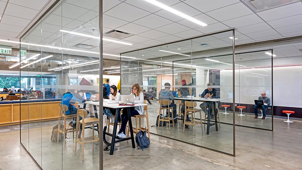 A group of people sitting at tables.