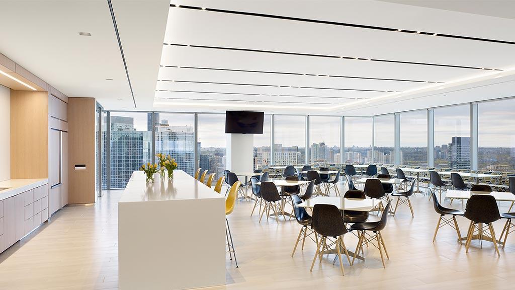 A room with tables and chairs.