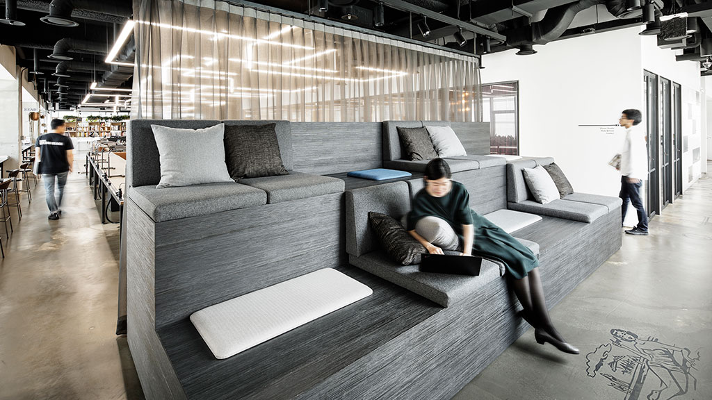 A person sitting on a couch.