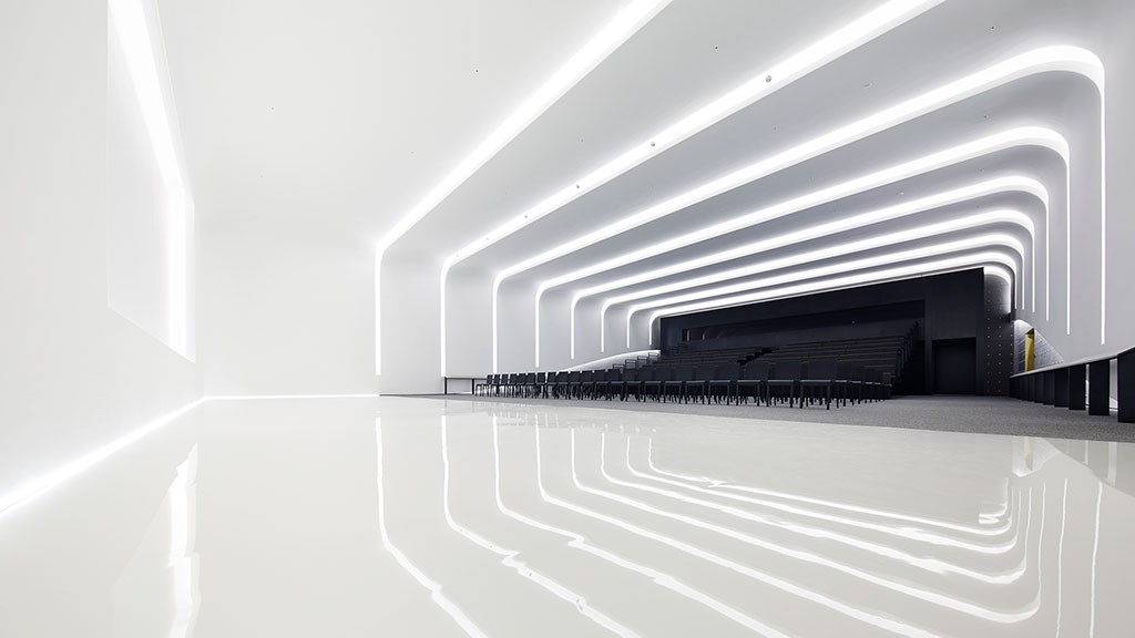 A white staircase with a black railing.