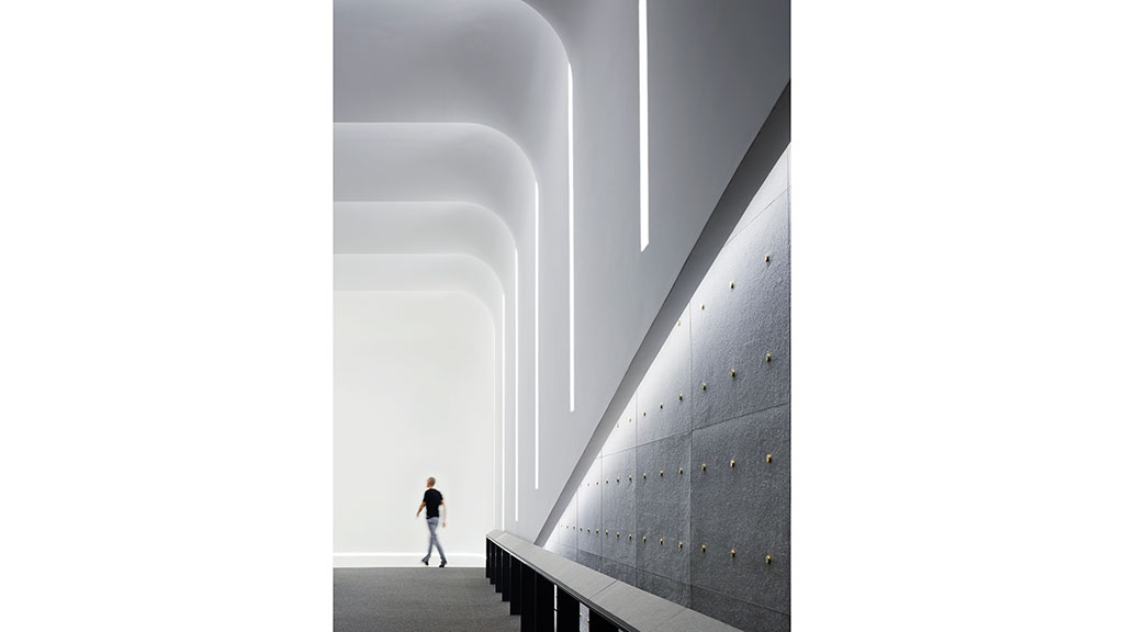 A person walking in a tunnel.