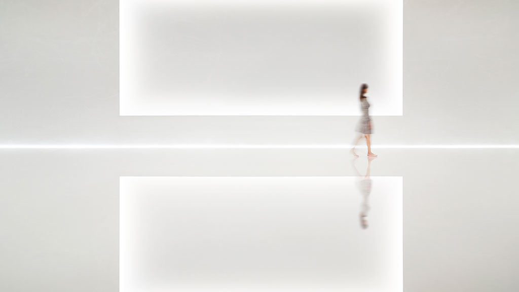 A person walking in a room.
