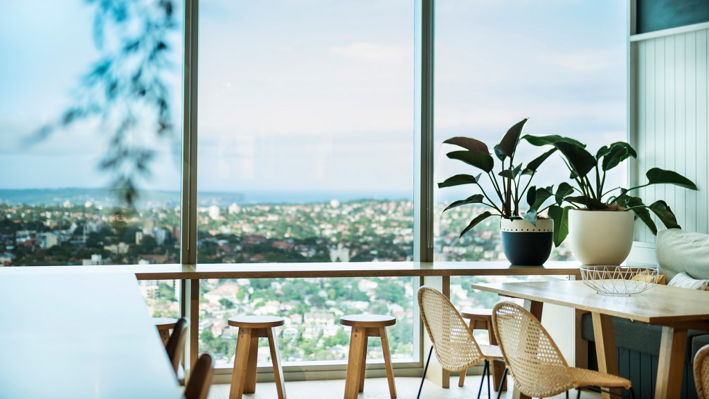 A table and chairs on a balcony.