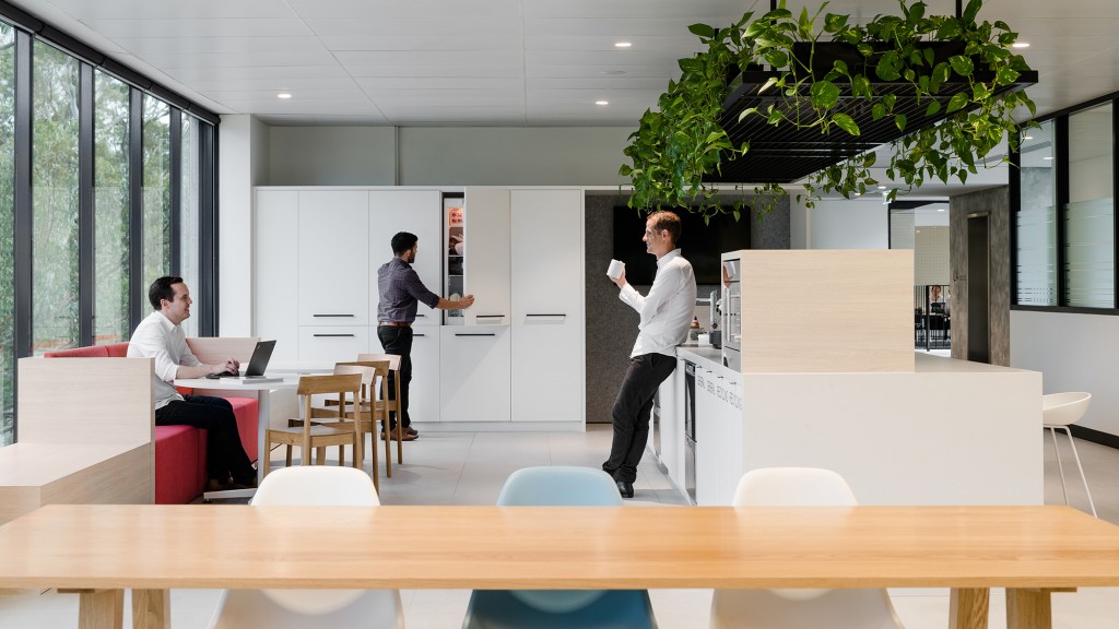 A man and a woman in an office.