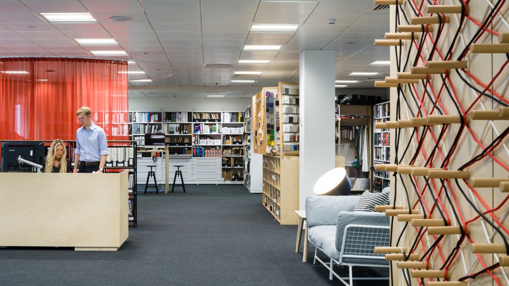 A man and a woman in a library.