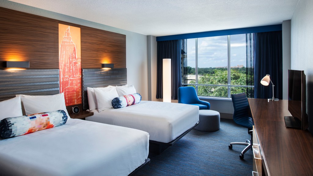 A hotel room with two beds.