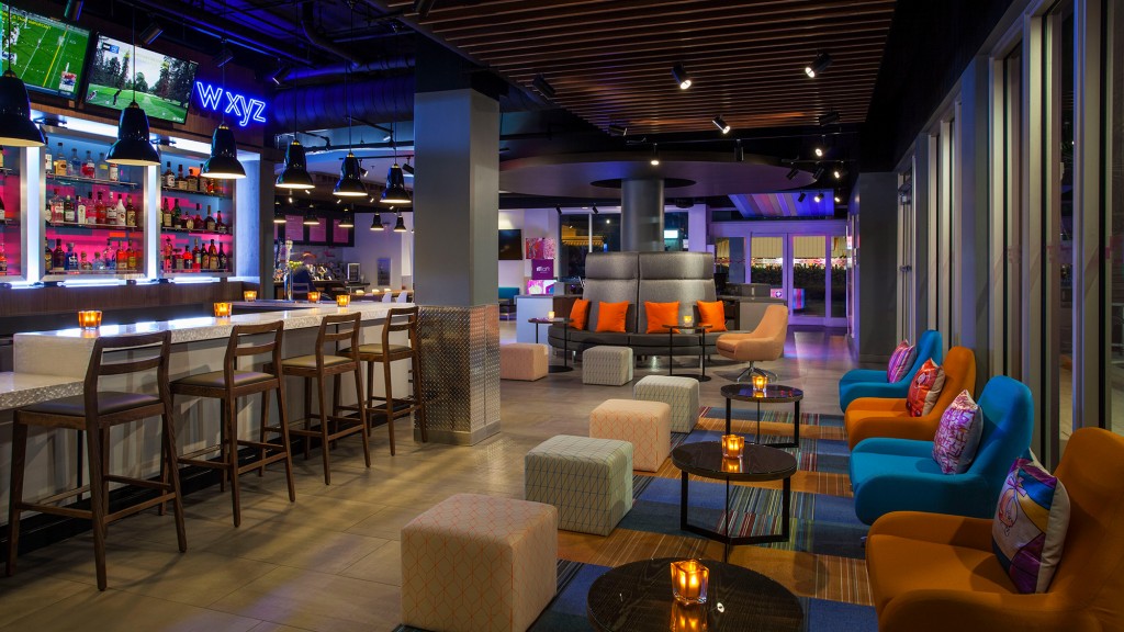 A bar with chairs and tables.