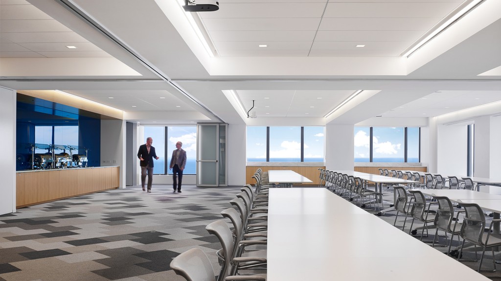 A large room with tables and chairs.