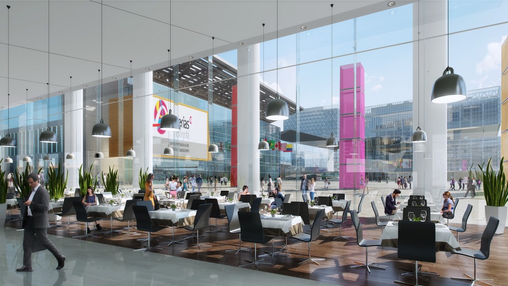 A room with a large glass wall and a group of people sitting at tables.