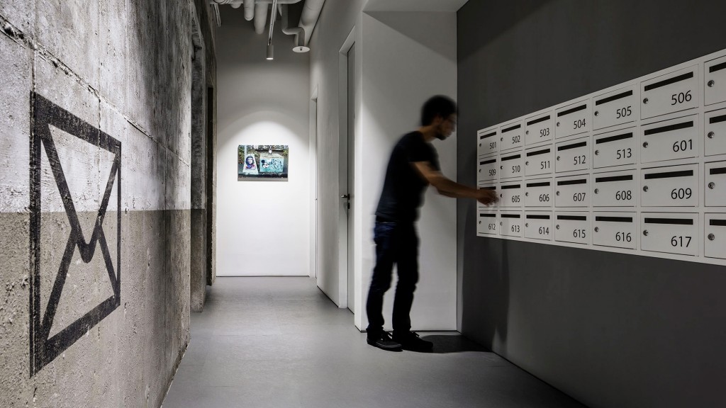 A person standing in a hallway.