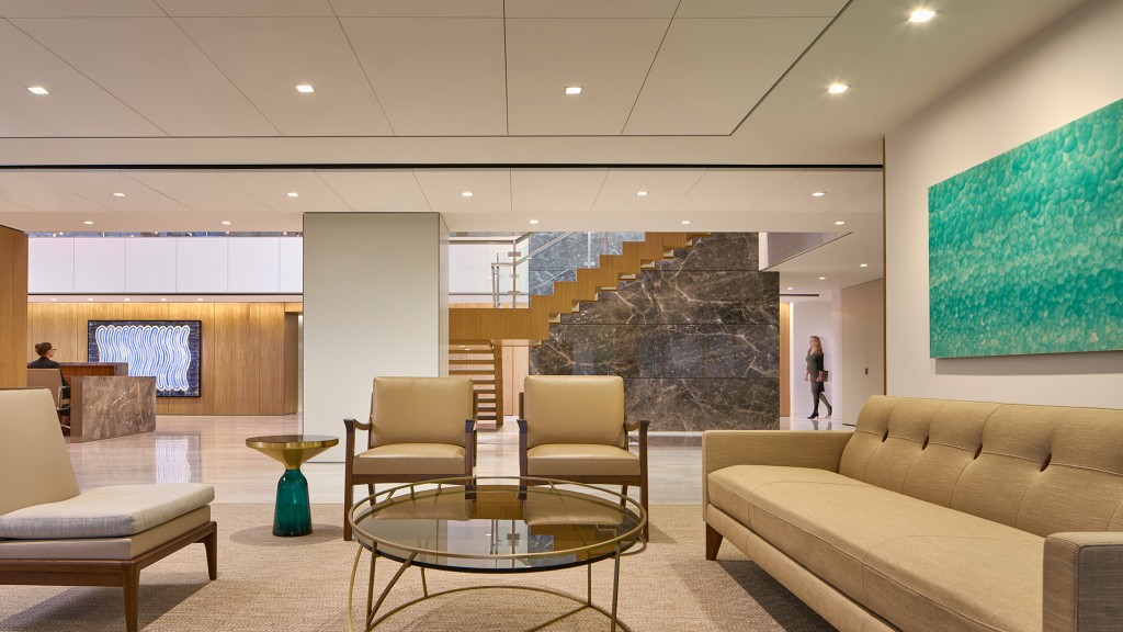 A room with a large screen and chairs.