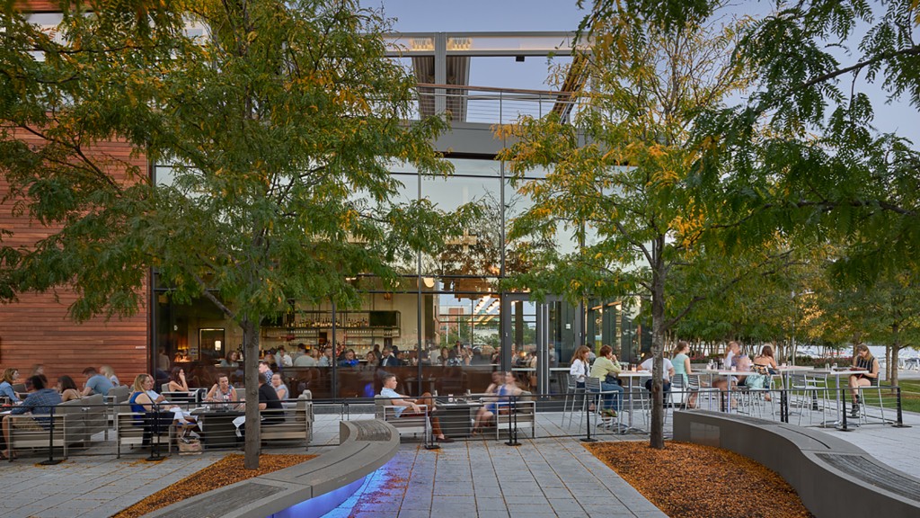 A group of people sitting on benches.