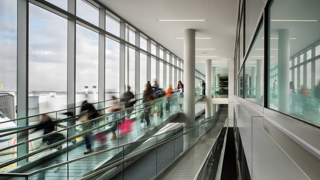 A group of people walking inside a building.