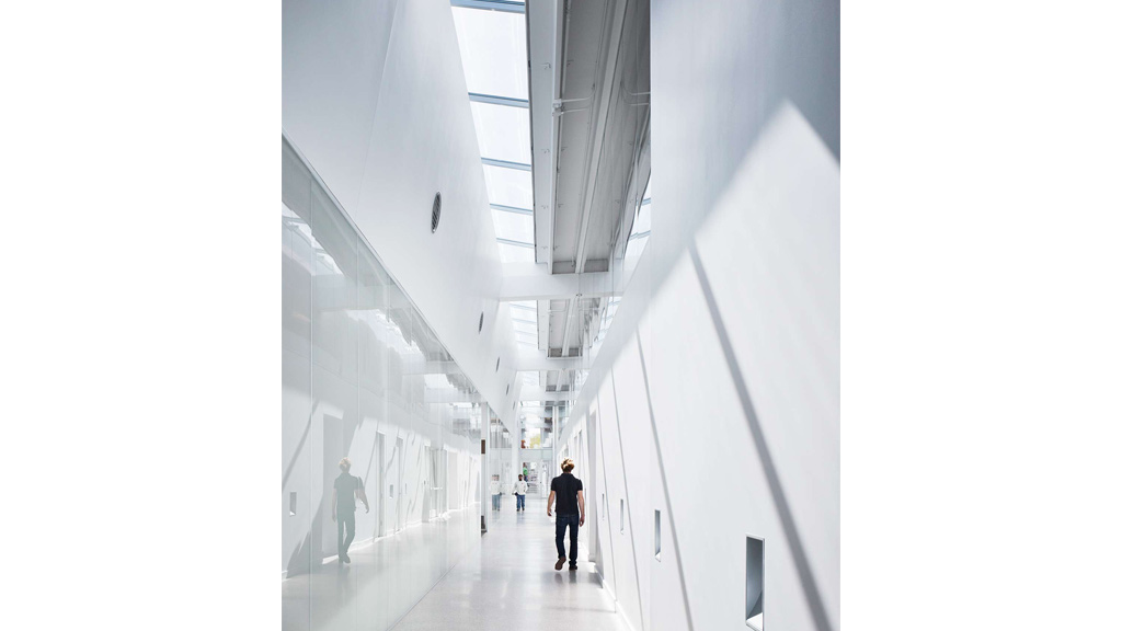 People walking in a corridor.