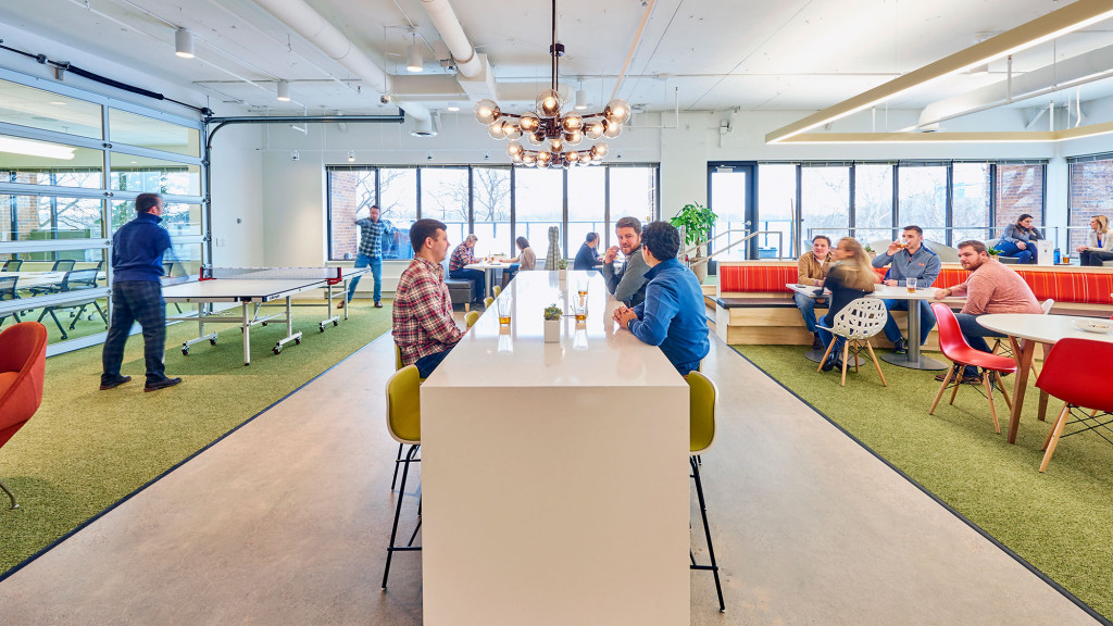 A group of people sitting at tables.