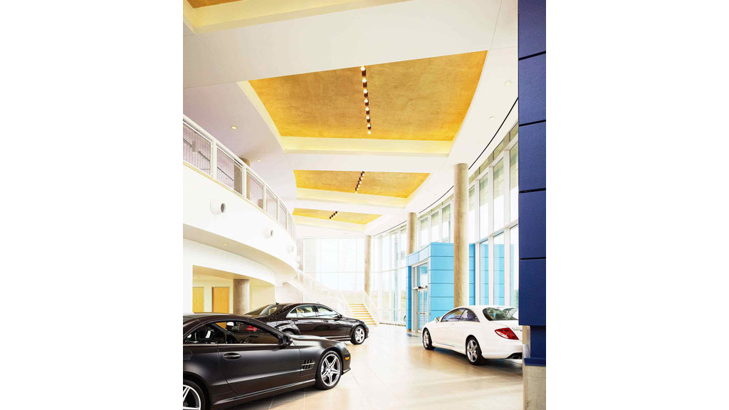 A group of cars parked in a building.