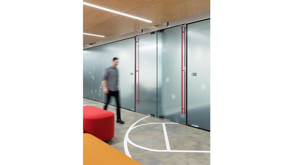 A person walking in a hallway.